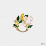 white flower with greenampyellow leaf brooch dgrie